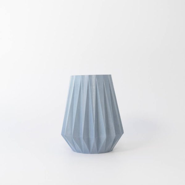 Buddy pet urn. Image of folded origami urn in ocean.